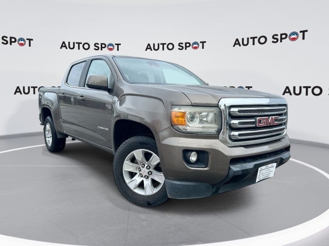 2016 GMC Canyon 2WD SLE in Bronze Alloy Metallic — front three-quarter view