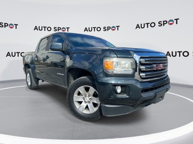 2017 GMC Canyon 2WD SLE in Dark Slate Metallic — front three-quarter view