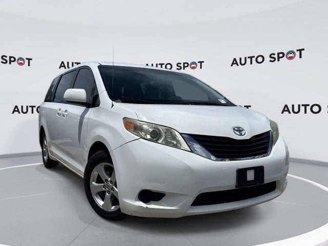 2014 Toyota Sienna LE AAS in White — front three-quarter view