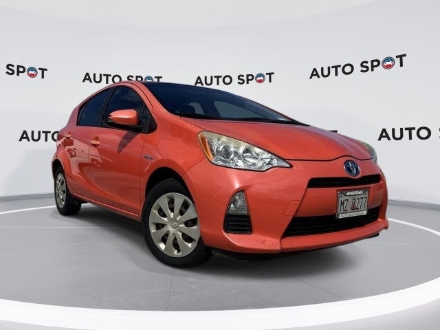 2014 Toyota Prius c One in Orange — front three-quarter view