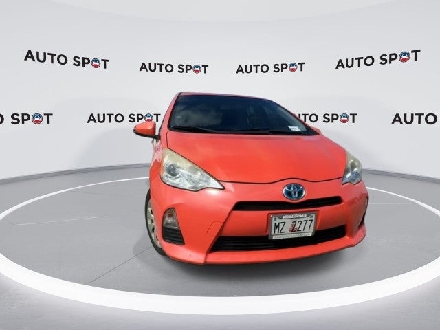 2014 Toyota Prius c — rear three-quarter view