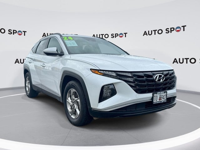 2024 Hyundai Tucson SEL in White — front three-quarter view