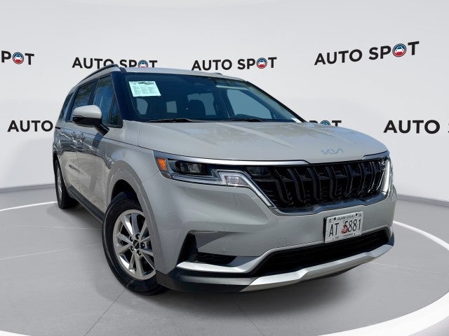 2023 Kia Carnival LX in Gray — front three-quarter view